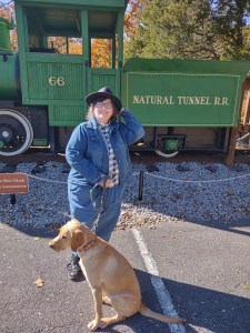 Woman with a yellow labrador retriever at Natural Tunnel State Park in Virginia.